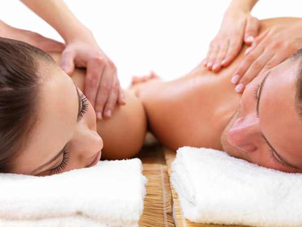 couple sitting next to each other and getting massage